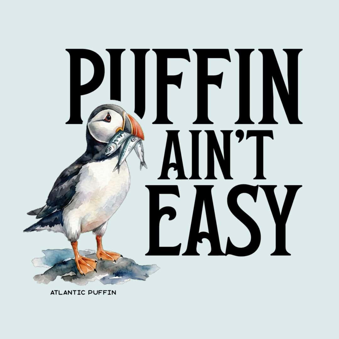 Illustration of a puffin holding a fish with text Puffin Ain't Easy.
